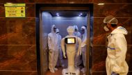 A robot named 'Mitra', which is used by the patients suffering from the coronavirus disease (COVID-19) to communicate with their relatives, is seen inside a lift of the Yatharth Super Speciality Hospital in Noida, on the outskirts of New Delhi, India, Sep