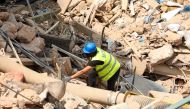 FILE PHOTO: A volunteer digs through the rubble of buildings which collapsed due to the explosion at the port area, after signs of life were detected, in Gemmayze, Beirut, Lebanon September 5, 2020. REUTERS/Mohamed Azakir/File Photo