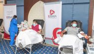 Employees of Ezdan Hotel donating blood during the campaign.