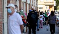 Residents queue to access the Cuzco healthcare centre in the under partial lockdown town of Fuenlabrada, in Madrid region, on September 22, 2020.   AFP / OSCAR DEL POZO