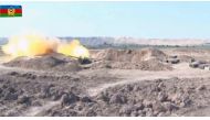An image grab taken from a video made available on the official web site of the Azerbaijani Defence Ministry on September 28, 2020, showing a combat operation during clashes between Armenian separatists and Azerbaijan in the breakaway region of Nagorno-Ka