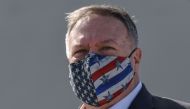 (FILES) In this file photo taken on September 29, 2020 US Secretary of State Mike Pompeo wears a protective face mask as he visits the Naval Support Activity base at Souda, the foremost US naval facility in the eastern Mediterranean on the Greek island of