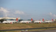 This file photo taken on April 19, 2020 shows passenger planes from carrier Philippine Airlines parked on the tarmac of Manila's international airport as air travel to and from the Philippines was suspended after the government implemented a lockdown in i