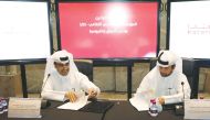 The Chairman of the Qatar Racing and Equestrian Club, Issa bin Muhammad Al Mohannadi (left) and the General Manager of the Cultural Village Katara, Dr. Khalid bin Ibrahim Al Sulaiti, signing the agreement documents during a ceremony held in Doha, yesterda