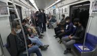 Iranian commuters wear face masks in a metro after Iranian authorities made it mandatory for all to wear face masks in public following the outbreak of the coronavirus disease (COVID19), in Tehran Iran October 10, 2020. Majid Asgaripour/WANA 