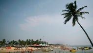 FILE PHOTO: Tourists relax at a cafe on Baga beach in the western Indian state of Goa March 16, 2008. REUTERS/Punit Paranjpe (INDIA)/File Photo