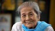 Daw Thein Khin, a 100-year-old woman survivor of the coronavirus disease (COVID-19) poses for a photo at her home, amid the outbreak of the disease, in Yangon, Myanmar, October 13, 2020. REUTERS/Shwe Paw Mya Tin