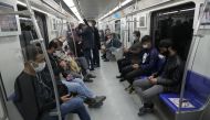 Iranian commuters wear face masks in a metro after Iranian authorities made it mandatory for all to wear face masks in public following the outbreak of the coronavirus disease (COVID19), in Tehran Iran October 10, 2020. Majid Asgaripour/WANA via REUTERS