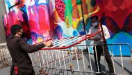 Barricades are set up near the Ratchaprasong junction ahead of a proposed gathering by pro-democracy protesters in Bangkok on October 15, 2020, after Thailand issued an emergency decree. / AFP / Jack Taylor 