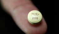 A tablet of Avigan - drug approved as an anti-influenza drug in Japan and developed by Toyama Chemical Co, a subsidiary of Fujifilm Holdings Co, is displayed during a photo opportunity at Fujifilm's headquarters in Tokyo, October 22, 2014. REUTERS/Issei K