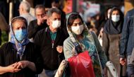 Iranians wear face masks as a Covid-19 coronavirus pandemic precaution, in Iran's capital Tehran on October 19, 2020. Iran today announced 337 deaths from the novel coronavirus, a record high for a single day in the Middle East country hardest hit by the 