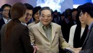 Samsung Electronics Chairman Lee Kun-hee meets with reporters after touring the Samsung booth at the 2012 International Consumer Electronics Show (CES) in Las Vegas, Nevada January 12, 2012. REUTERS/Steve Marcus/File Photo