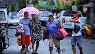Residents evacuate from their home in the coastal area of Legaspi City, Albay province south of Manila on October 25, 2020, ahead of tropical storm Molave's expected landfall. AFP / Charism SAYAT