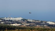 An aircraft flies over a base for U.N. peacekeepers of the United Nations Interim Force in Lebanon (UNIFIL) in Naqoura, near the Lebanese-Israeli border, southern Lebanon October 29, 2020. REUTERS/Aziz Taher
