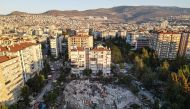 An aerial view taken on October 31, 2020, in Izmir shows Rescue workers searching for survivors in a collapsed building after a powerful earthquake struck Turkey's western coast and parts of Greece.  AFP / Ozan KOSE