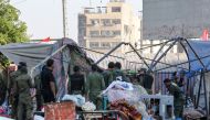 Members of the Iraqi security forces clear protesters' encampments during the reopening of the Iraqi capital Baghdad's central Tahrir Square on October 31, 2020. AFP / Sabah ARAR