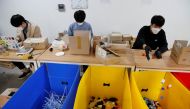 Volunteers separate different types of plastic at Plastic Mill in Seoul, South Korea, October 29, 2020. Picture taken October 29, 2020. REUTERS/Heo Ran