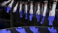 Newly-made gloves are pictured inside Top Glove factory in Shah Alam, Malaysia August 26, 2020. REUTERS/Lim Huey Teng/File Photo/File Photo