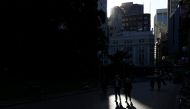 People walk through a park in the city centre of Sydney, Australia, November 9, 2020. REUTERS/Loren Elliott