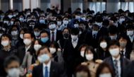 People wearing protective masks, following the coronavirus disease (COVID-19) outbreak, make their way at Shinagawa station in TOKYO, Japan November 13, 2020. REUTERS/Kim Kyung-Hoon
