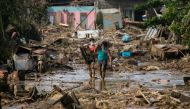 Residents retrieve belongings from their submerged village following floods caused by Typhoon Vamco, in Rodriguez, Rizal province, Philippines, November 14, 2020. REUTERS/Eloisa Lopez