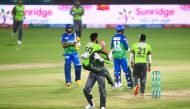 Lahore Qalandars' cricketers celebrate after winning the Pakistan Super League (PSL) Twenty20 cricket match between the Multan Sultans and Lahore Qalandars at the National Stadium in Karachi on November 15, 2020.  / AFP / Asif HASSAN

