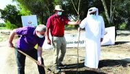 Officials of MME and players of Al Rayan Sport Club plant a tree in Al Rayan Park as part of the initiative.
