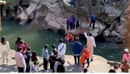 Stephen Ellison, British consul-general in Chongqing, rescues a drowning student, who had fallen into a river by accident, at a scenic spot in Chongqing, China November 14, 2020, in this screengrab taken from video. Jiang Lang via British consulate in Cho