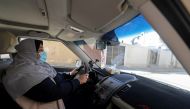 Palestinian woman Naela Abu Jibba, who started a women-only taxi service in Gaza Strip, drives her vehicle at Beach refugee camp in Gaza City November 17, 2020. Picture taken November 17, 2020. REUTERS/Mohammed Salem