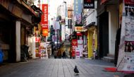 A pigeon walks at an empty shopping district amid the coronavirus disease (Covid-19) pandemic in Seoul, South Korea, November 23, 2020. REUTERS/Kim Hong-Ji