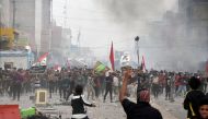 Anti-government protesters clash with supporters of Iraqi Shi'ite cleric Moqtada al-Sadr in Nassiriya, Iraq November 27, 2020. REUTERS/Ahmed Dhahi