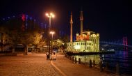 General view of the deserted Ortakoy square, during a night-time curfew aimed at curbing the spread of the Covid-19 pandemic caused by the novel coronavirus, in Istanbul, on November 28, 2020. A partial curfew from 8pm to 10am started in Turkey on Novembe