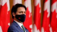 FILE PHOTO: Canadian Prime Minister Justin Trudeau listens while wearing a mask at a news conference held to discuss the country's coronavirus disease (COVID-19) response in Ottawa, Ontario, Canada November 6, 2020. REUTERS/Patrick Doyle//File Photo

