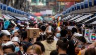 Filipinos wearing masks and face shields for protection against the coronavirus disease (COVID-19) walk along a street market in Manila, Philippines, December 3, 2020. Reuters/Eloisa Lopez