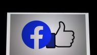 FILE PHOTO: A Facebook App logo is displayed on a smartphone on March 25, 2020 in Arlington, Virginia.  AFP / Olivier DOULIERY