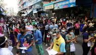 Migrant workers queue for a COVID-19 nasal swab test at a migrant community, amid the coronavirus disease (COVID-19) outbreak, in Samut Sakhon province, in Thailand, December 20, 2020. REUTERS/Athit Perawongmetha