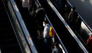 People ride on escalators amid the coronavirus disease (COVID-19) outbreak at a railway station in Seoul, South Korea, December 21, 2020. REUTERS/Kim Hong-Ji