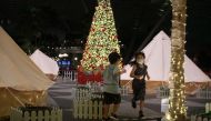 Children play a game of tag at Changi AirportÕs indoor glamping grounds after checking in, in Singapore, December 21, 2020. Picture taken December 21, 2020. REUTERS/Ying Shan Lee