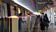 People wear protective masks to prevent the spread of the coronavirus disease (COVID-19) while riding the metro in Taipei, Taiwan, December 23, 2020. REUTERS/Ann Wang