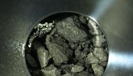 This handout photograph released by the Japan Aerospace Exploration Agency (JAXA) on December 24, 2020 shows samples of soil from the asteroid Ryugu, inside C compartment of the capsule collected by the Hayabusa-2 space probe, at JAXA Sagamihara Campus in