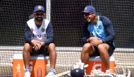 India's captain Ajinkya Rahane (L) chats with Umesh Yadav (R) during a training session ahead of the second cricket Test match against Australia, in Melbourne on December 24, 2020. AFP / William West 