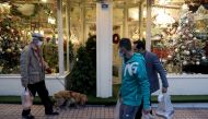 Iranian people walk past a Showcase of a Christmas store in Tehran, Iran December 23, 2020. Picture taken December 23, 2020. Majid Asgaripour