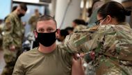A U.S. Air Force soldier gets a coronavirus disease (COVID-19) vaccine at Osan Air Base in Pyeongtaek, South Korea, December 29, 2020. Staff Sgt. Betty R. Chevalier/U.S. Air Force/DVIDS/Handout via REUTERS