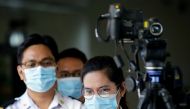 Airport personnel monitor a thermal scanner as passengers arrive at the Ninoy Aquino International Airport in Pasay, Philippines, January 23, 2020. REUTERS/Eloisa Lopez/File Photo