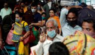 People wearing protective masks exit a railway station amid the spread of the coronavirus disease (COVID-19) in Mumbai, India, December 11, 2020. Reuters/Francis Mascarenhas/File Photo