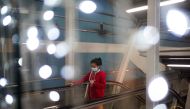 A woman wears a face mask inside a department store, after the Thai government ordered a temporary closure of various public facilities, amid the spread of the coronavirus disease (COVID-19), in Bangkok, Thailand January 2, 2021. REUTERS/Athit Perawongmet