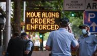 New South Wales police officers guard an entrance as part of Covid-19 restrictions for New Year celebrations around Circular Quay in central Sydney on December 31, 2020. AFP / DAVID GRAY
