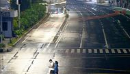 People walk during large-scale social restrictions to prevent the spread of coronavirus disease (COVID-19) on New Year's Eve in Jakarta, Indonesia, December 31, 2020. REUTERS/Ajeng Dinar Ulfiana