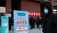 People line up to get a nucleic acid test at a hospital following an outbreak of the coronavirus disease (COVID-19) in Beijing, China January 7, 2021. REUTERS/Thomas Peter