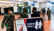 Indonesian soldiers are seen at Soekarno-Hatta International Airport after Sriwijaya Airplane flight SJ182 lost contact. Reuters/Willy Kurniawan